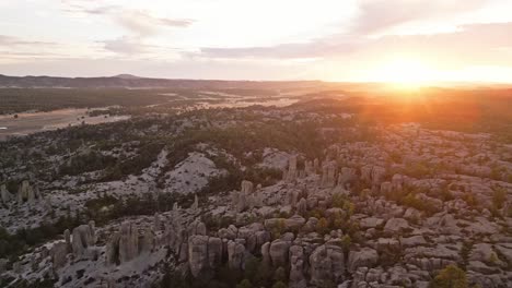Golden hour light illuminates the stunning rock formations in Valle de los Monjes, Chihuahua