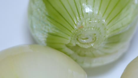 peeled onions in a white bowl