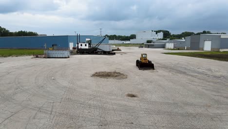 aerial view of old marina equipment on a concrete lot