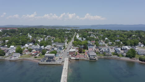 aerial: rising and moving forward over the town of saint andrews, new brunswick