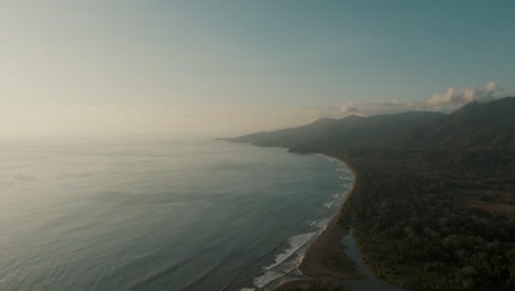 misty atmosphere at whale's tail uvita beach in costa rica, central america