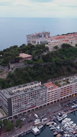 Monte Carlo, Monaco. Vertical Aerial View of Old Town Buildings and Museums on Cliff Above Mediterranean Sea, Drone Shot