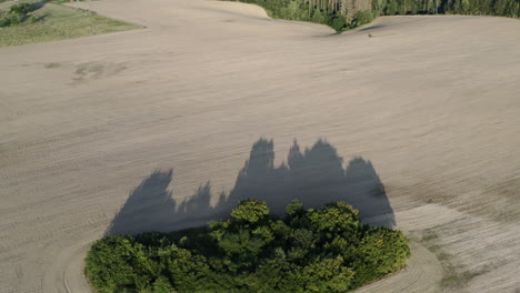 aerial shot of beautiful rural landscape at sunrise in czech republic, farmland and forest mountains