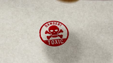 toxic danger with skull stamp and stamping loop animation