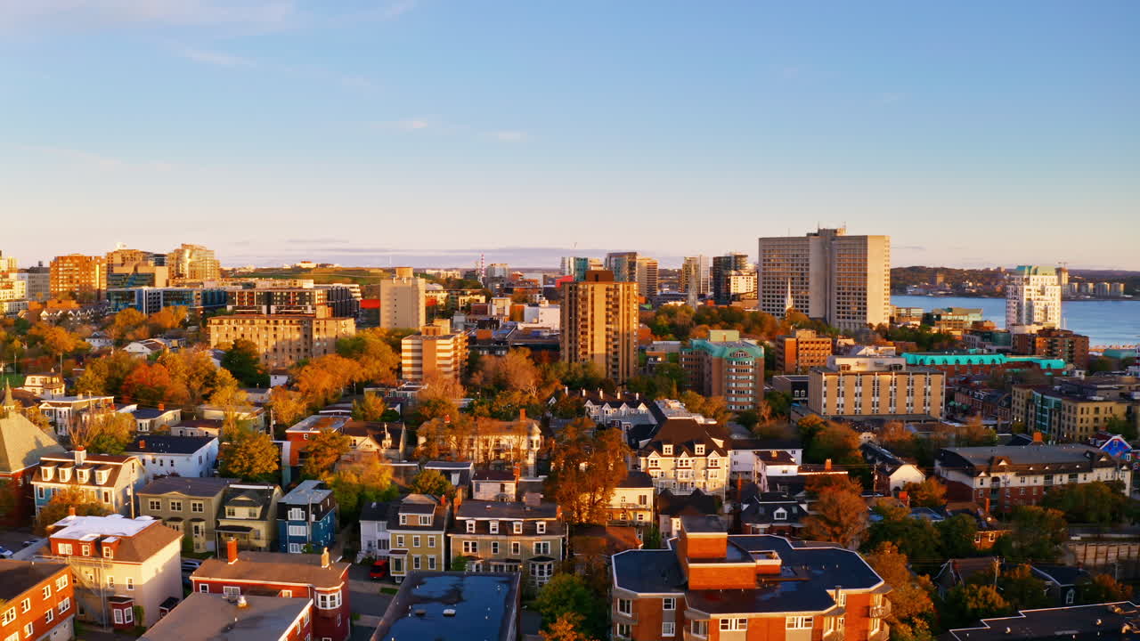 Sunrise aerial drone shot over Halifax downtown, Nova Scotia, Canada.
High view of the golden landscape and sea at down as the sun is rising in the early morning.
