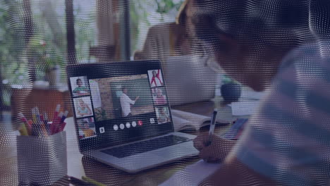 taking notes during virtual meeting on laptop, person focusing on animation