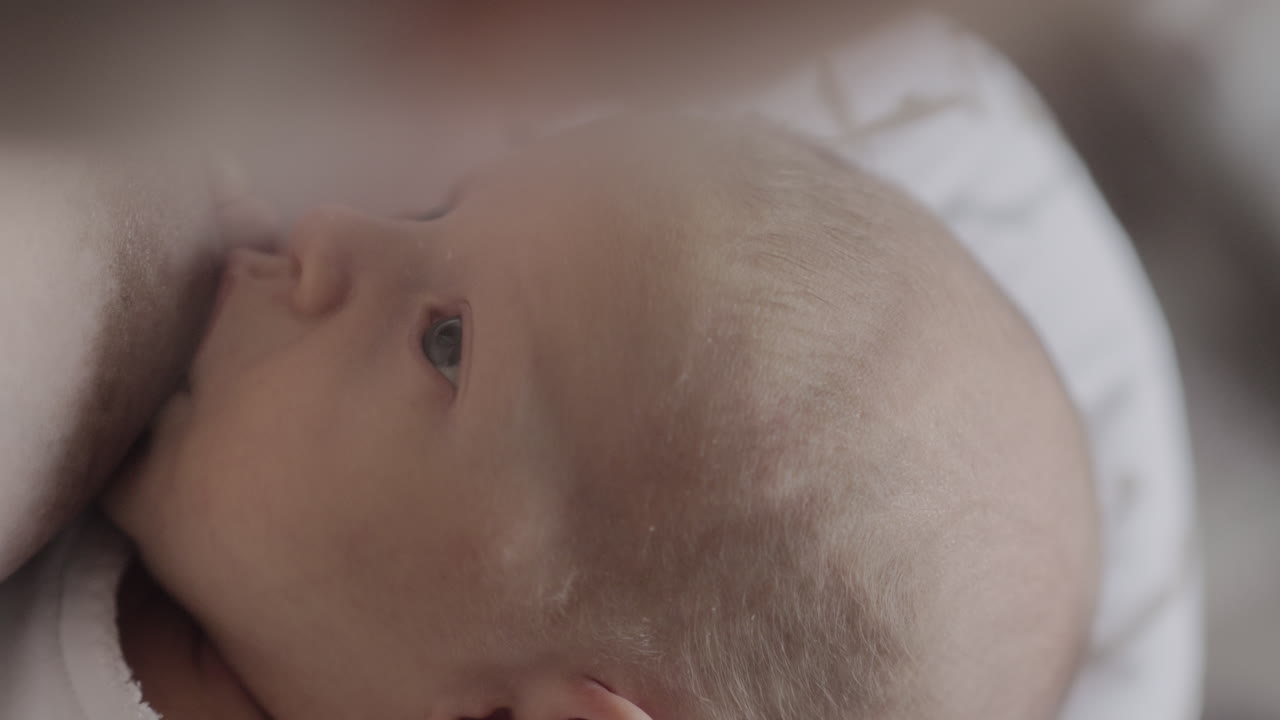 Mum breastfeeding newborn baby