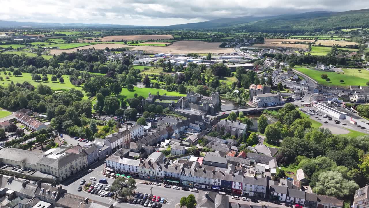 Cahir historic old town - aerial wide panorama with castle, river and settlement, green valley. Ireland
