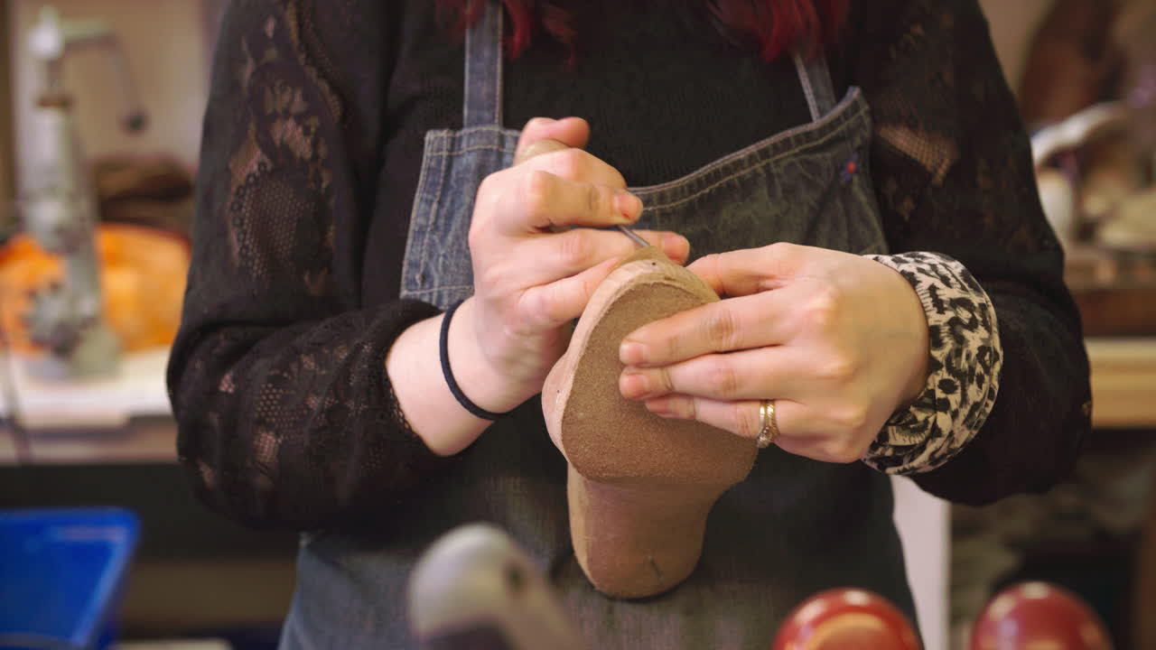 Bespoke Shoemaker Pinning Leather Together To Make Shoe