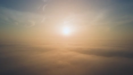 Aerial-drone-shot-of-atmospheric-sunrise-above-the-clouds