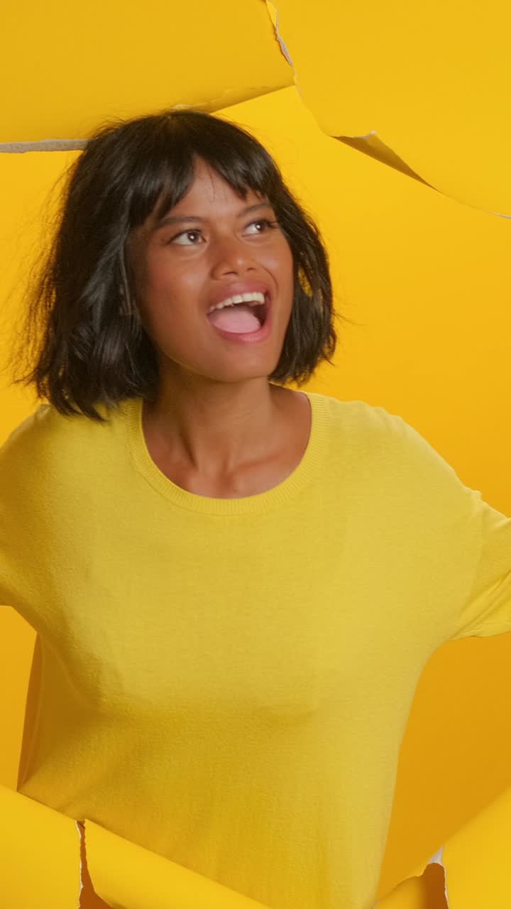 Bright yellow backdrop enhances expressive moment of creativity and reflection