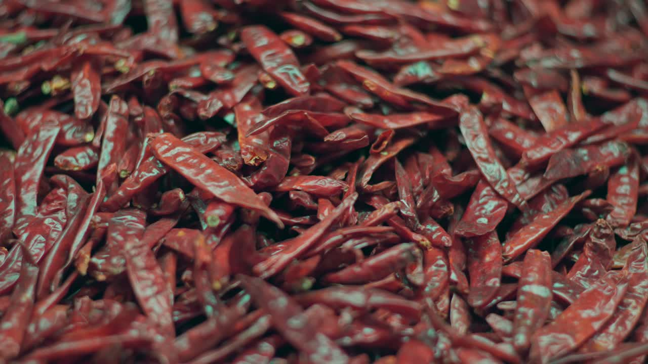 SLOW MOTION CLOSE UP SHOT OF DRIED CHILIS IN A MARKET IN OAXACA