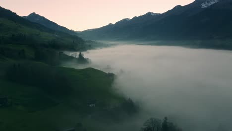 fog in a valley during sunset in the mountains