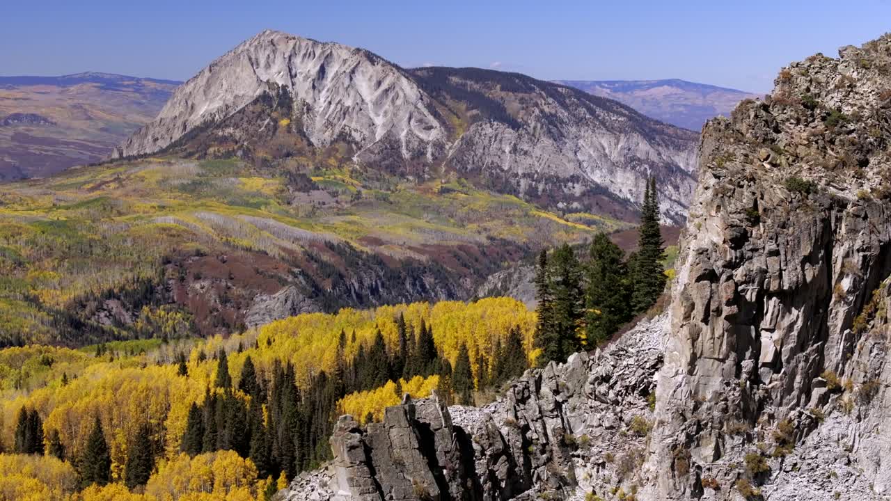 Aerial views of Colorado's Ragged and Marcelina mountain ranges during the vibrant colorful fall season