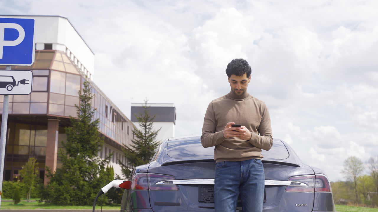 Young man looking at camera outdoors
