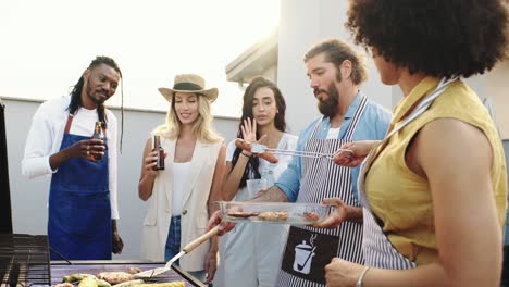 friends enjoying a rooftop barbecue party