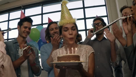 female business executive celebrating her birthday with coworkers