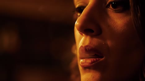 a captivating portrait of emotions, expression, and gentle smoke: delving into the intricacies of beauty and reflection in a dimly lit setting
