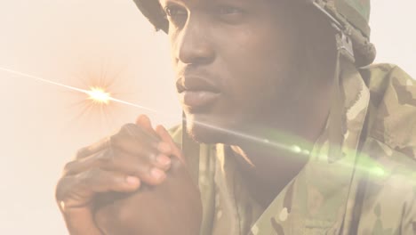 animation of light trails over african american male soldier