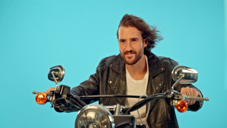 motorbike, driver and happy man in studio on blue