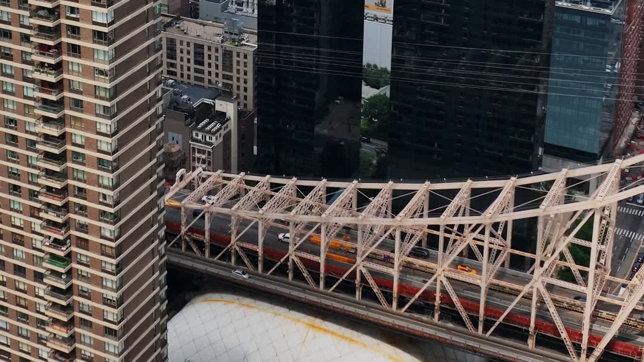 Colorful train crossing over East River in New York City