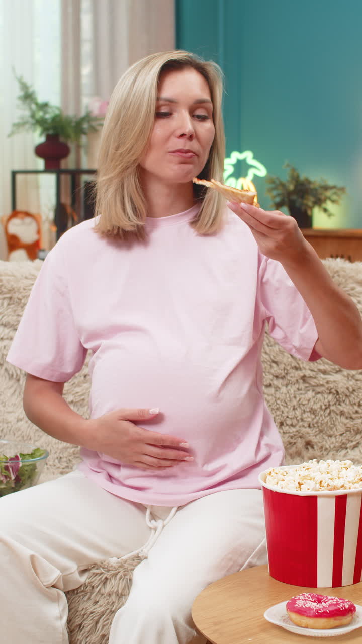 Pregnant woman craving pizza chocolate fruit vegetables chips popcorn with strong pregnancy hunger