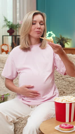 pregnant woman craving pizza chocolate fruit vegetables chips popcorn with strong pregnancy hunger