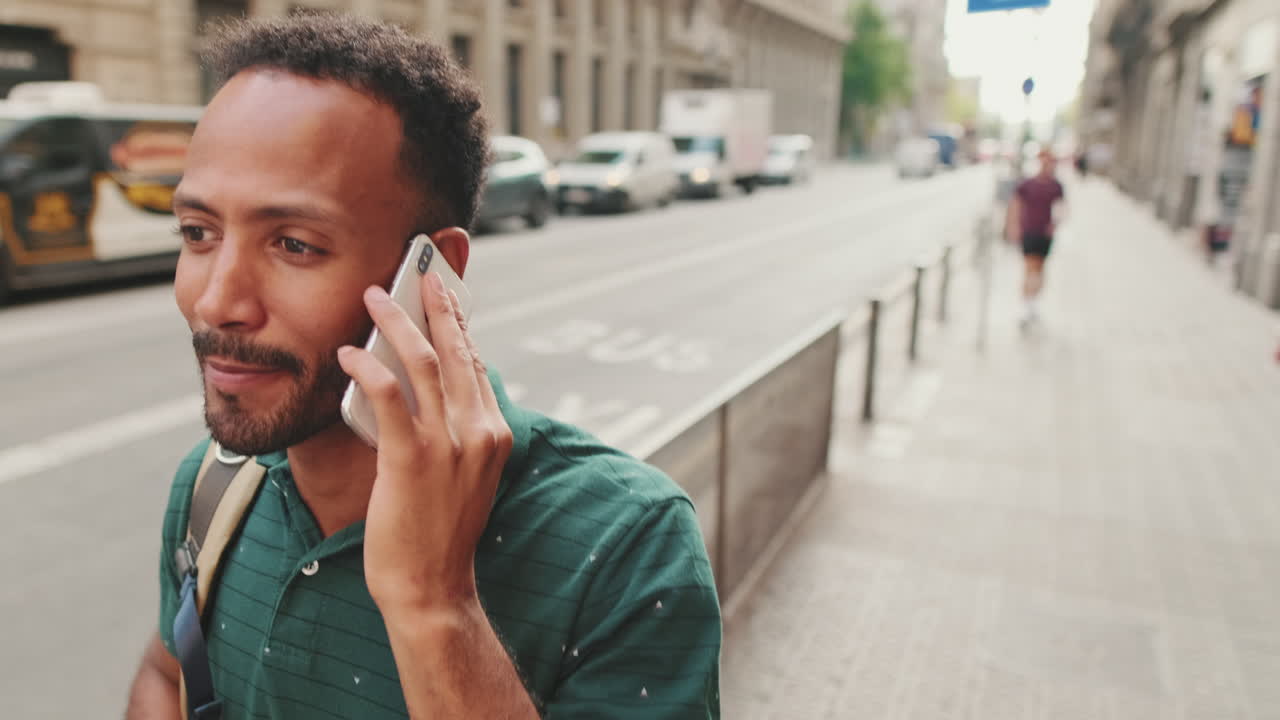 Man on phone call on city street