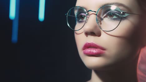 colored light portrait woman eyeglasses neon glow