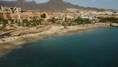 beautiful panoramic view with blue sea at seaside in los cristiano south of tenerife drone shot mediterranean