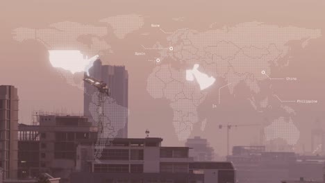 animation of illuminated map with countries name over modern buildings against sky