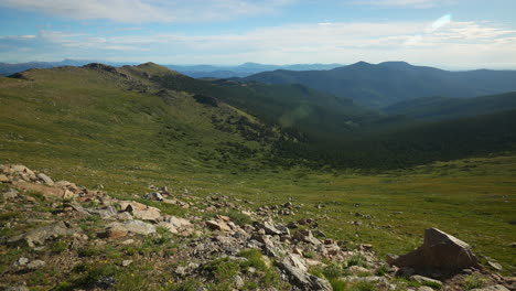 Cinematic-late-morning-open-view-Denver-Mount-Evans-snow-Summit-Echo-Chicago-lakes-14er-front-range-foothills-Rocky-Mountains-Idaho-Springs-Evergreen-slow-motion-wide-scenic-landscape-pan-to-the-right