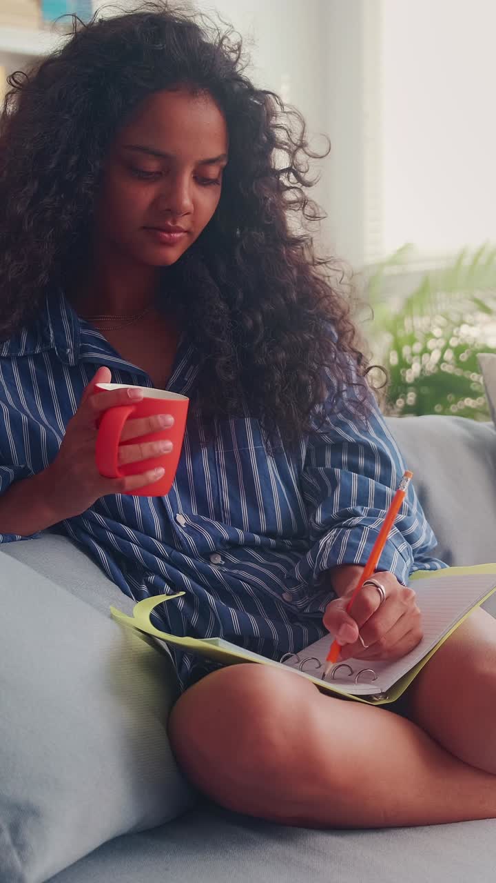 Enjoying a cozy morning while journaling and sipping tea in india