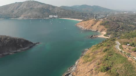 wide-view-over-Nai-harn-Reef-and-Nai-Harn-Beach-in-southern-Phuket,-in-Thailand---Aerial-Fly-over-shot