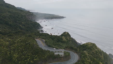 coastal road through new zealand mountains