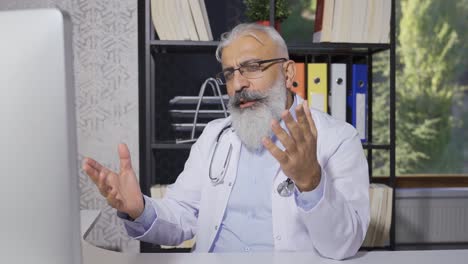 senior doctor doing online examination with his patient.