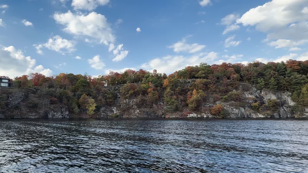 Beautiful fall season in Muskoka Ontario with forested shoreline and blue lake, adventure and travel inspiration
