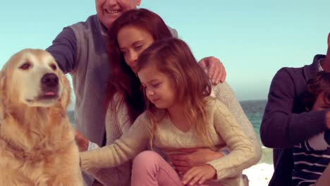 Happy-extended-family-smiling-with-dog