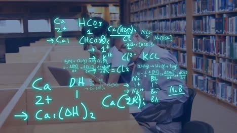 Animation-of-equations-over-caucasian-male-teacher-and-student-using-laptop-and-tablet-in-library