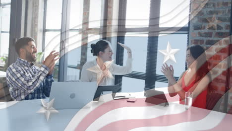 celebrating business success, diverse team in office over american flag animation