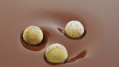 4k video of three sweets in motion in chocolate.