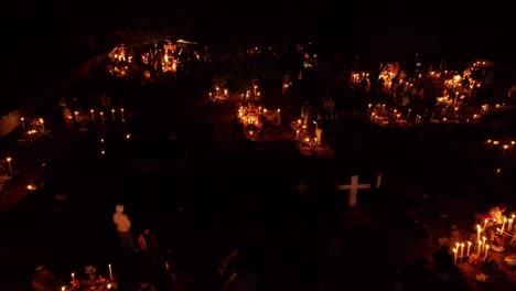 drone: doly out shot of a graveyard in pacanda island at patzcuaro michoacan on dia de muertos (day of the death)