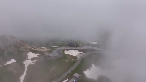 Heavy fog covers Großglockner High Alpine Road, creating a mysterious atmosphere