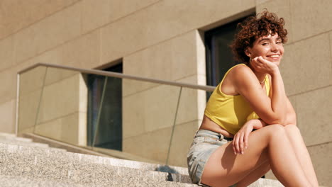 young woman sitting on steps