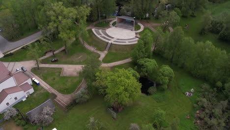 aerial view of an outdoor amphitheater in a green park setting