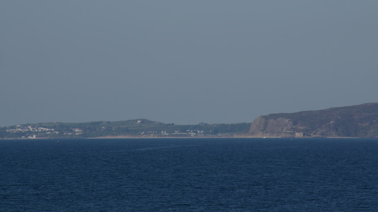 Long shot of Llanbedrog and The Warren Beach, Abersoch from Hafan y Môr nature reserve