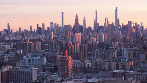 aerial view of the new york city skyline at dusk. shot in harlem looking south towards midtown manhattan.
