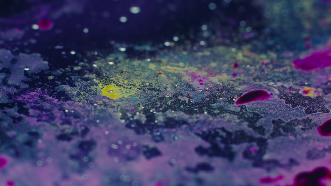 Colourful, organic, liquids macro shots buzzing and flowing