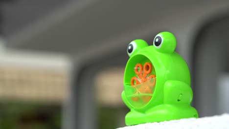 green frog toy release bubble