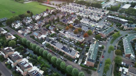 aerial view of a beautiful suburban neighborhood with solar panels on rooftops